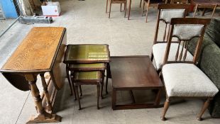 A pair of Edwardian oak dining chairs with pad upholstered back and seats on tapering legs together