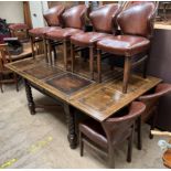 An oak extending dining table and six chairs