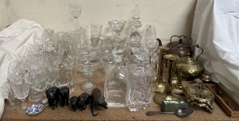 A silver dessert spoon together with brass candlesticks, copper kettle, glass decanters,