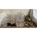 A silver dessert spoon together with brass candlesticks, copper kettle, glass decanters,