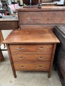 A small Edwardian writing desk with a frieze drawer and four other drawers on square tapering legs,