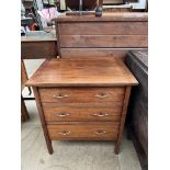 A small Edwardian writing desk with a frieze drawer and four other drawers on square tapering legs,