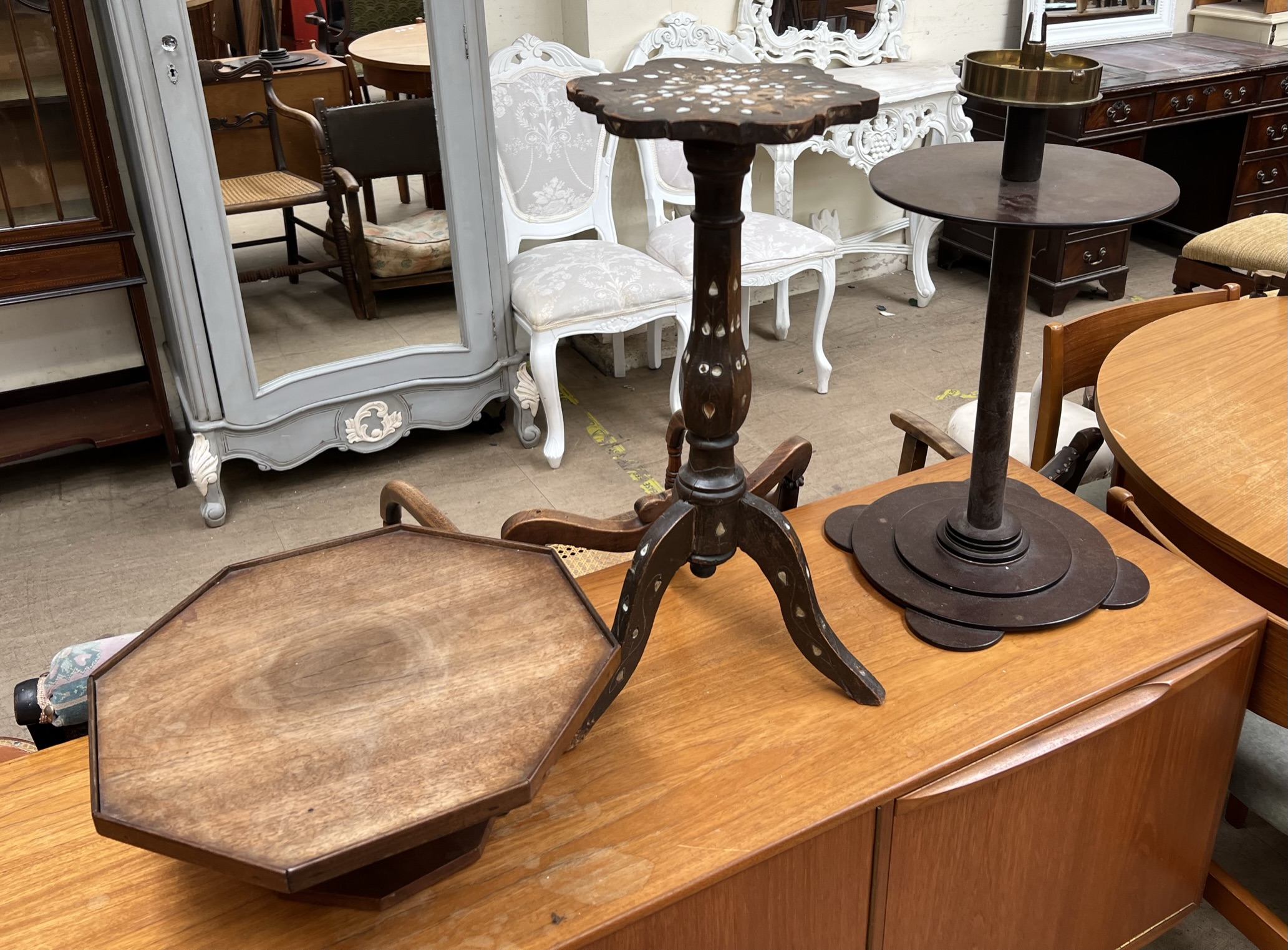 A bakelite and brass shell case ashtray stand together with an inlaid occasional table and a
