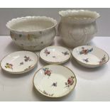 Two Belleek porcelain jardinieres together with four continental porcelain dishes decorated with