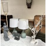 A pair of pottery table lamps together with a tree lamp, candle stand,