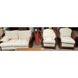 A hardwood double caned bergere suite with cream upholstered cushions