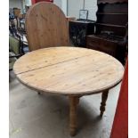 A pine dining table with interchangeable top,