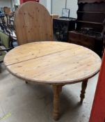 A pine dining table with interchangeable top,