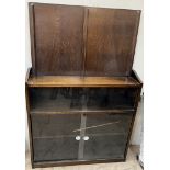 An oak bookcase with interchangeable doors ***PLEASE NOTE THAT THIS LOT WILL BE DISPOSED OF 14