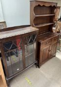 A 20th century oak dresser together with a display cabinet