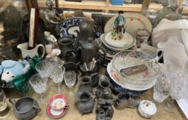 A silver backed brush together with a glass bowl, drinking glasses, pewter jugs, spelter figure,