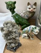 A Mosanic pottery cat with a green glass eyes and open mouth together with a majolica lion,