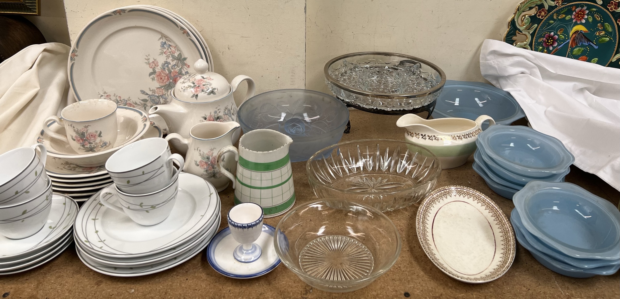 A floral moulded blue glass bowl together with part tea sets,