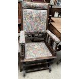 An American rocking chair with a pad upholstered seat,