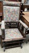 An American rocking chair with a pad upholstered seat,