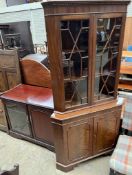 A reproduction mahogany standing corner cupboard, the top with a pair of astragal glazed doors,