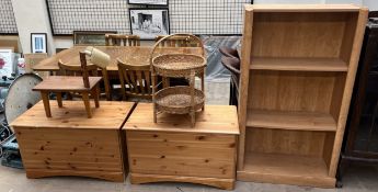 A pair of pine coffers together with a bookcase,