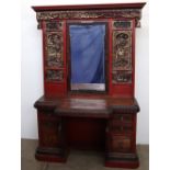 A Chinese lacquered hall stand, profusely carved with figures in a landscape with a central mirror,