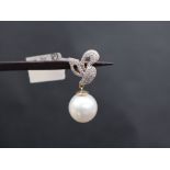 Gemporia - An 18ct gold South Sea cultured pearl and diamond pendant,