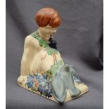 An Ashtead pottery Percy Metcalfe harvest bookend of a boy with pigeons, printed and painted marks,