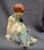 An Ashtead pottery Percy Metcalfe harvest bookend of a boy with pigeons, printed and painted marks,