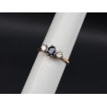 A sapphire and diamond three stone ring,