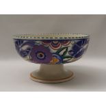 A Poole pottery pedestal bowl, the exterior decorated with blue birds and flower heads,