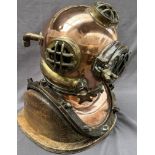 A Brass and copper US navy diving helmet, bears a label "U.S.