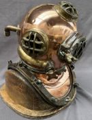 A Brass and copper US navy diving helmet, bears a label "U.S.