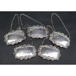 A matched set of five silver decanter labels for Brandy, Whisky, Port, Sherry and Gin, Birmingham,