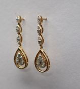 Gemporia - A pair of 18ct gold diamond set Tomas Rae earrings, totalling 1.