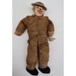 A World War II Oliver "Hardy" Tommy clown doll, in British uniform with steel helmet,