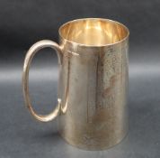 A George V silver tankard of tapering cylindrical form, Sheffield, 1920, James Dixon & son, 12.