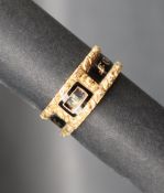 A 19th century 18ct gold Momento Mori ring with black enamel band "IN MEMORY OF" and panel for lock