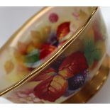 A Royal Worcester porcelain bowl painted to the centre with blackberries and leaves signed for,