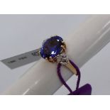 Gemporia - An 18ct gold Tanzanite and diamond Lorique ring, with an oval 4.