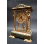 An early 20th century French gilt metal champleve enamel and onyx four glass mantle clock,