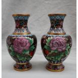 A pair of Japanese cloisonne enamel decorated vases decorated with birds and flowers, 18.