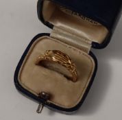 A Victorian yellow metal fede and triple hoop gimmel clasped hands and hearts betrothal ring hinged