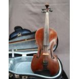 A late 19th century violin, with a one piece back and ebonised stringing,