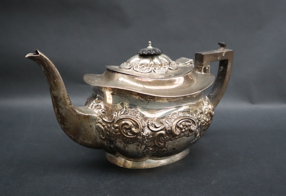 An Edward VII silver teapot of oval form embossed with flowers, leaves and scrolls, Birmingham, - Image 3 of 5