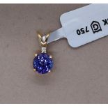 Gemporia - An 18ct gold Tanzanite and diamond Tomas Rae pendant, with a round 1.