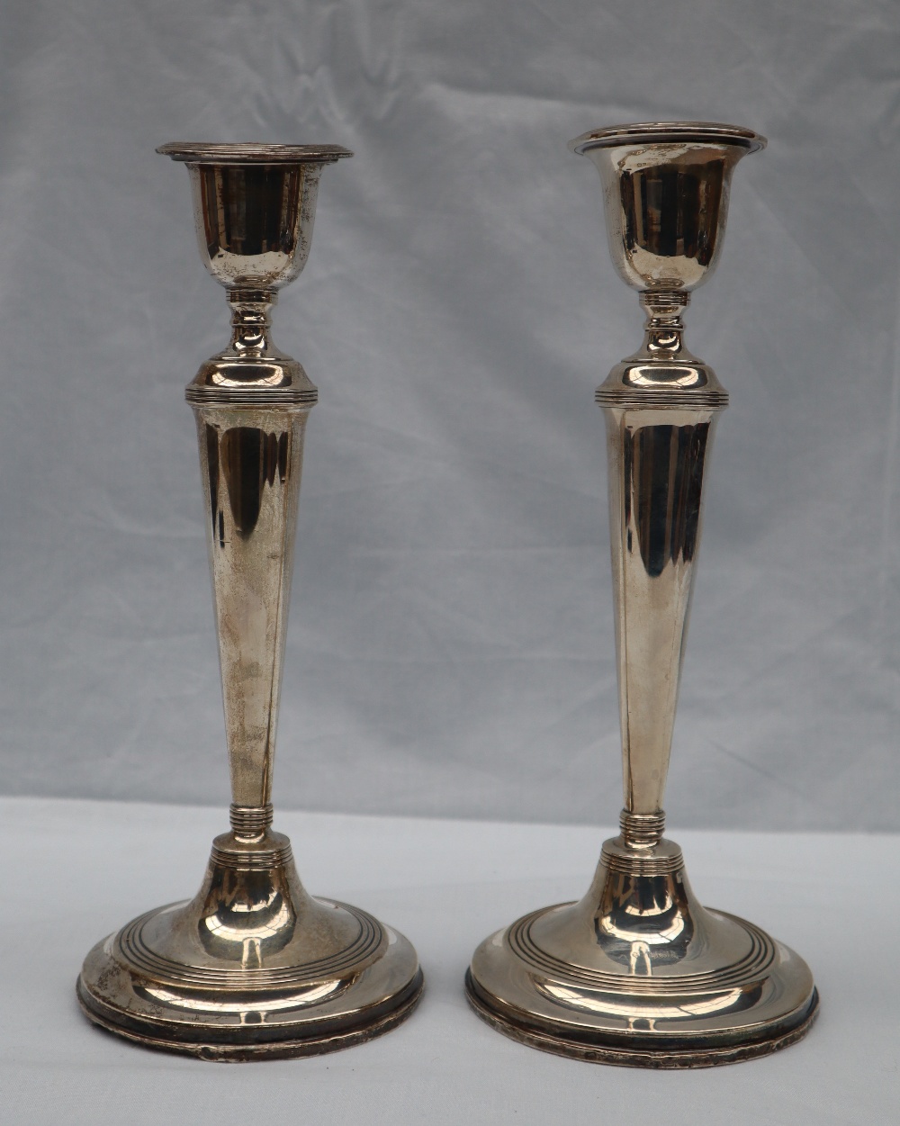 A pair of George VI silver candlesticks, with a shaped sconce and tapering body on spreading foot, - Image 4 of 4