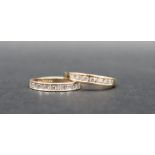 A 9ct gold half eternity ring set with nine round brilliant cut diamonds to a white metal mount and