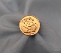 A George V gold Sovereign dated 1918 affixed to a yellow metal ring mount,