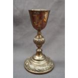 A Victorian Irish silver chalice, with a tapering bowl and grape and vine decorated knop,