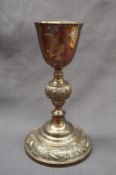 A Victorian Irish silver chalice, with a tapering bowl and grape and vine decorated knop,