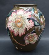 A Moorcroft pottery ovoid vase decorated in the "Gustavia Augusta" pattern to a green ground Trial