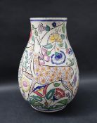 A Poole pottery vase decorated with a deer amongst flowers and leaves, impressed and painted marks,