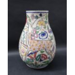 A Poole pottery vase decorated with a deer amongst flowers and leaves, impressed and painted marks,